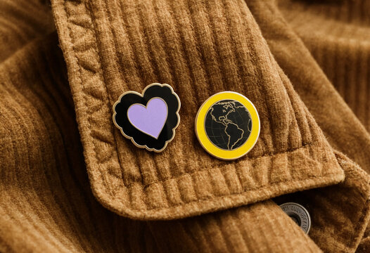 Enamel pin mockup template presentation on brown corduroy jacket