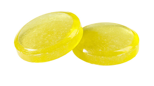 Two shiny yellow oval hard candies, isolated on transparent background