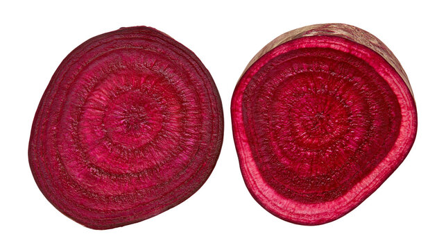 Two cross-sections of a vibrant red beet showing concentric rings, isolated on transparent background