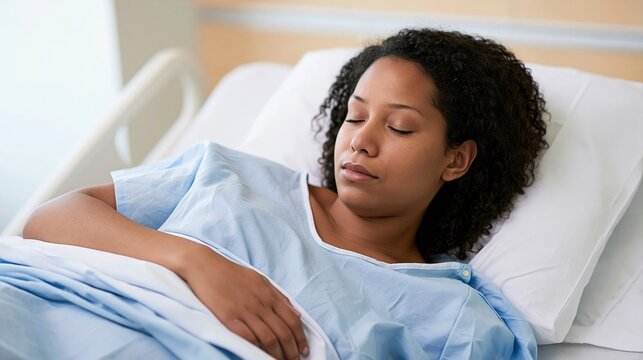 Peaceful patient sleeping in hospital bed with blue gown