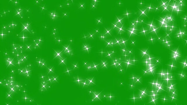 Glowing white four point star particles flashing dynamically, symmetrical sparkling glitter burst reveal transition overlay animation, magical festive backdrop on green background. 4k video