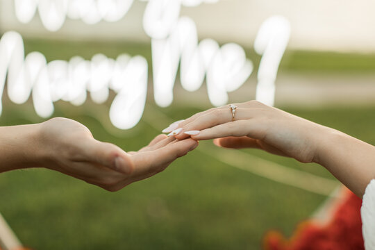 a couple holding hands after a marriage proposal