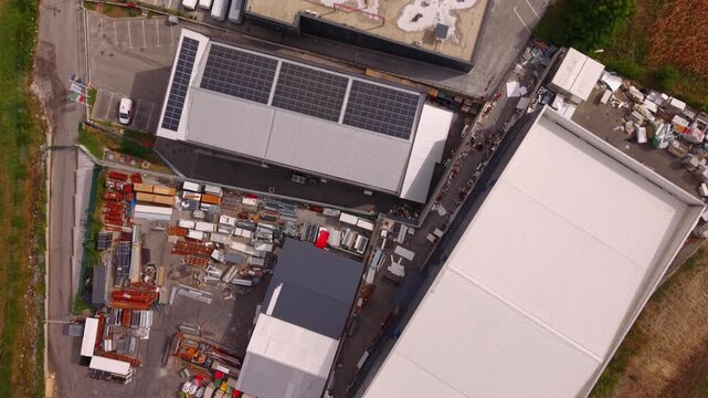 Aerial Top Down View of Solar Panels on Warehouse Roof in Krivoglavci Industrial Zone Near Vogosca Bosnia and Herzegovina