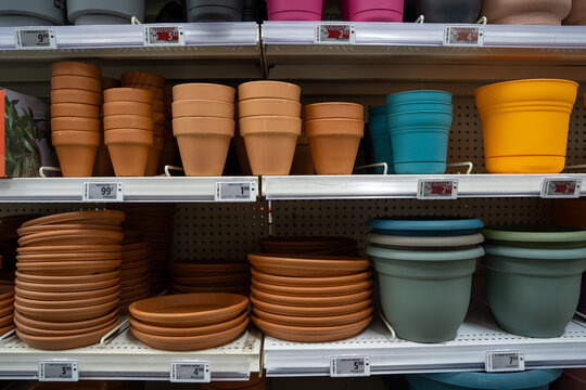 View of colorful plant pots on retail store shelves.