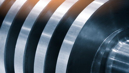 Industrial open mixer with screw in food industry close-up. Metallic coils display polished, smooth...