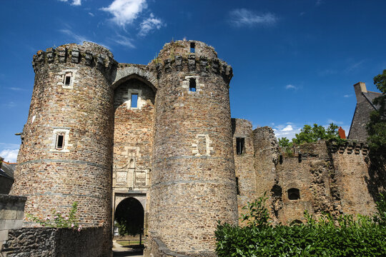 Stone entrance tower and fortified walls of Chateau de Chateaubriant medieval castle under blue sky Loire-Atlantique France