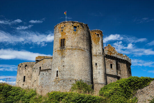 Round stone tower and ancient fortifications of Chateau de Clisson medieval castle under deep blue summer sky Loire-Atlantique France