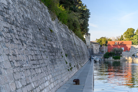 Promenade along the Venetian city walls at the Fosa harbor, Zadar, Croatia