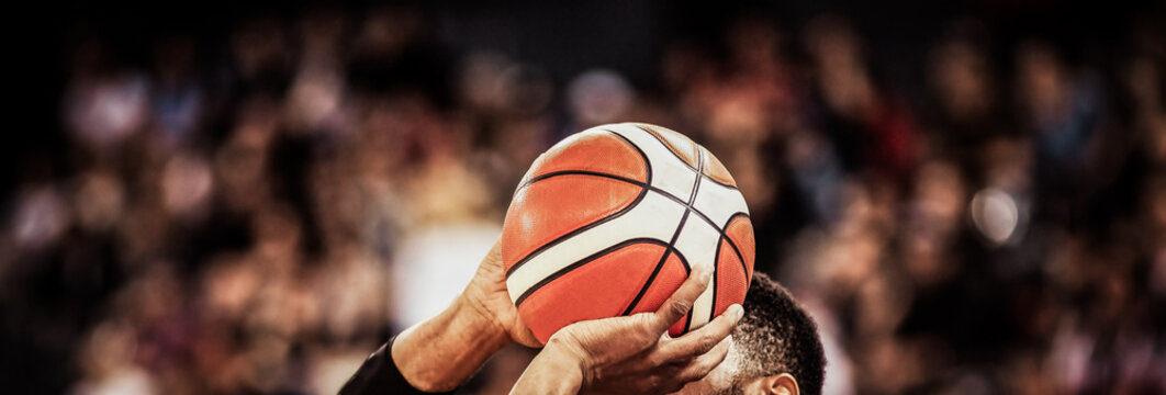 basketball player shooting three pointer