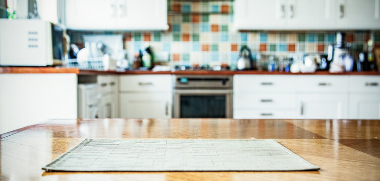blurred kitchen interior with napkin on table