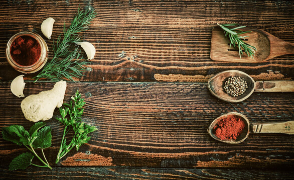 Spices and herbs on wooden table. Top view
