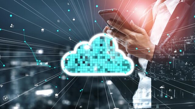 A businessman holds a smartphone amid a cloud computing graphic, symbolizing connectivity and digital transformation in a modern urban landscape at night. Xenic
