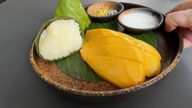 Serving a Place of Mango and Sticky Rice