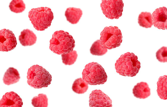 Fresh raspberries flying in air against white background
