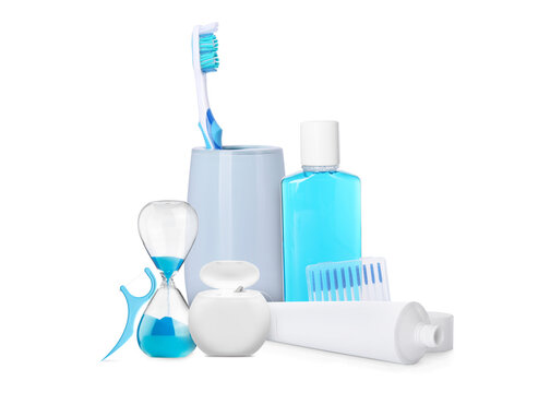 Dental care products and hourglass isolated on white. Oral hygiene routine