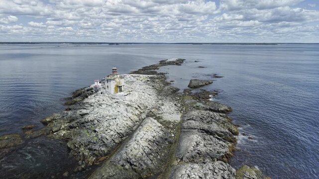 Derelict Gull Rock Lighthouse bestrides a guano encrusted Atlantic rock outcropping 5km south of picturesque fishing village Lockeport, Nova Scotia Canada.  MAX QUAL PRORES422HQ 4K HLG HDR BT.2100