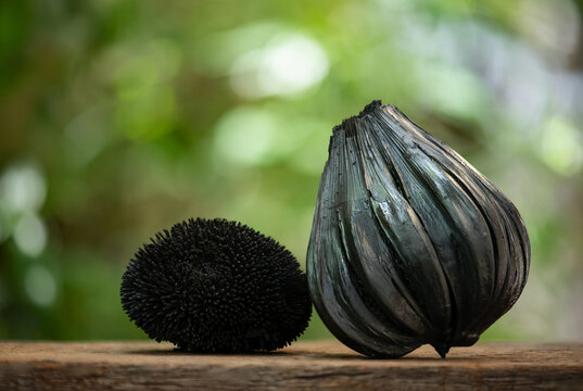 iochar from burning fruits on natural background.