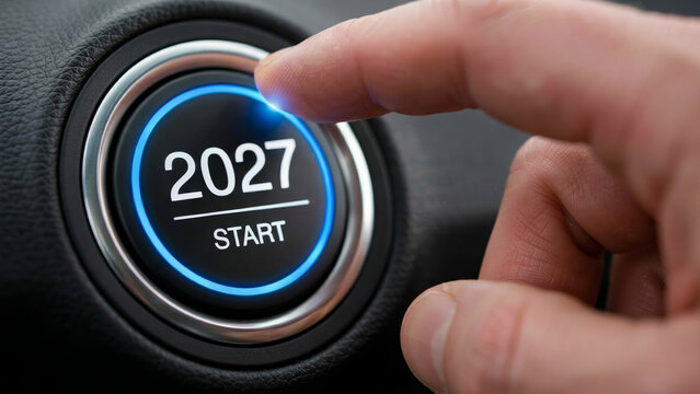 Finger pressing 2027 start engine button with glowing blue light in car interior, new year beginning, future planning, and motivation concept.