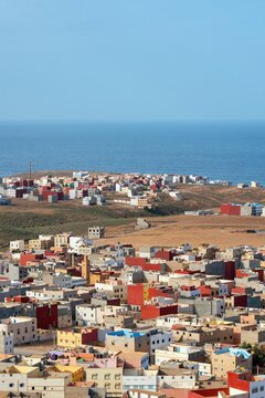 View of the colorful buildings and houses of the coastal town overlooking the Atlantic Ocean in Mirleft, Guelmim-Oued Noun, Morocco.