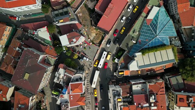 Turkey, Istanbul 01 10 2025: Top down 4K drone video of busy Muallim Naci Street traffic, pedestrians, red rooftops and Etz Ahayim Jewish Synagogue in Besiktas.
