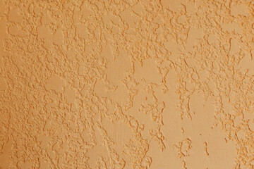 Fototapeta premium Decorative textured plaster wall surface in warm beige color