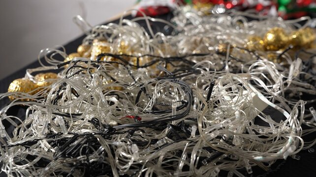 Christmas decorations waste. Fairy lights, LEDs and electronics. Used electric garland recycling