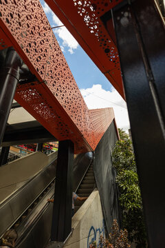 Outdoor escalators in San Javier, Comuna 13, Medell&iacute;n, Colombia, featuring prominent urban mobility infrastructure integrated into the city's surroundings