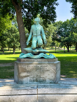 Boston, Massachusetts, USA - June 29, 2026: Religion statue in Boston Common Park, on Parkman Plaza. Backed by trees and green foliage