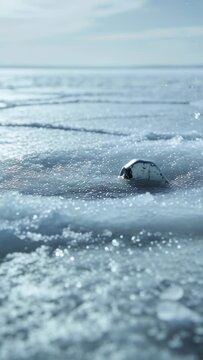 Vertical video: Advancing slush pushing damaged metal module across ice plain, exposing PCB traces