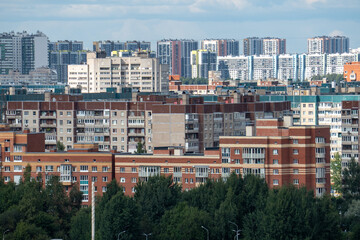 Naklejka premium Modern city skyline panorama with residential apartment buildings under blue sky. 