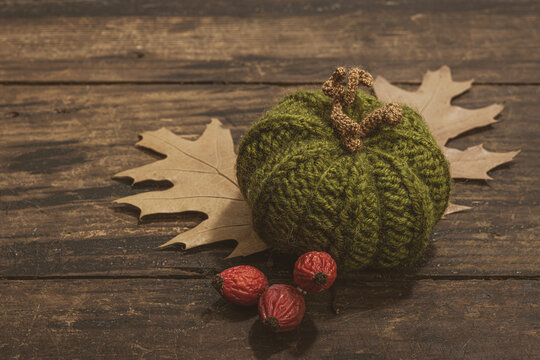 Autumn cozy mood composition. Crocheted pumpkins, handmade, fall hobby concept