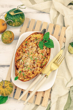 Baked spaghetti squash with spices, herbs and tomato sauce. Gluten free food, healthy dinner, vegan