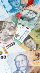 Indonesian rupiah money bills in pile on table. Indonesia IDR currency cash close up © Viktor