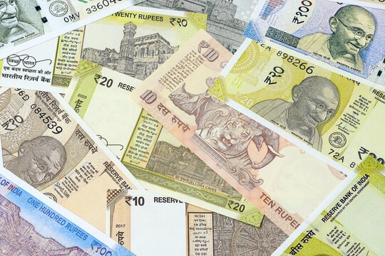 Indian rupee money bills in pile on table. India INR currency cash close up
