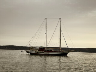 Fototapeta premium Serene Sailing Vessel at Dusk