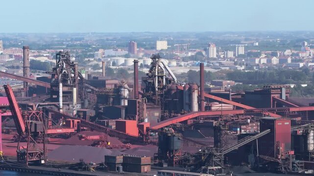 Aerial drone view of a heavy metallurgical plant producing steel. Industrial facility with manufacturing buildings and infrastructure.