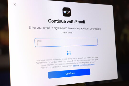 Sign in page with continue with email form on streaming service app displayed on screen. User authentication interface for online video platform. Digital account login and subscription concept.