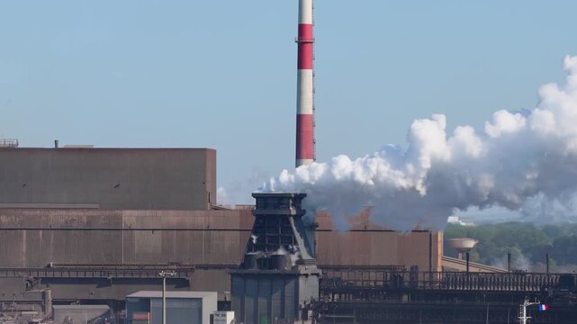 Aerial drone view of a heavy metallurgical plant producing steel. Industrial facility with manufacturing buildings and infrastructure.
