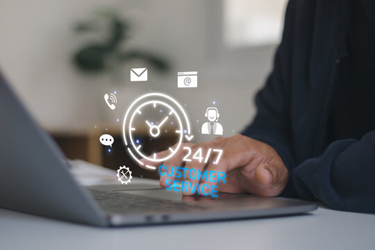 24-7 customer service concept showing a businessman using a laptop with digital communication icons, clock, chat, email and support symbols, representing online assistance and business support.