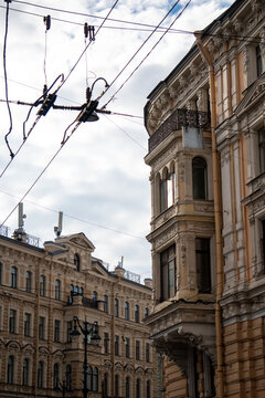Classic historic building stone facade with art nouveau ornaments and windows pattern close up.
