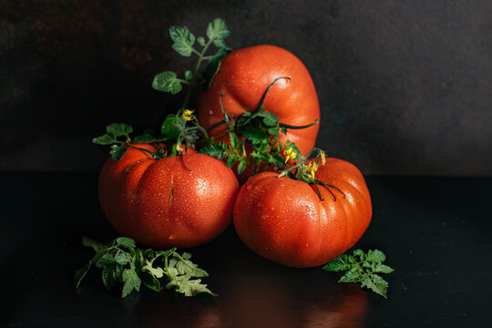 red tomatoes on a wooden table