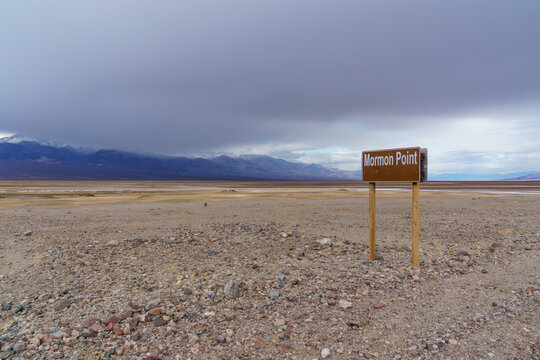 Mormon Point Sign Desert Landscape Under Cloudy Sky. Death Valley, California