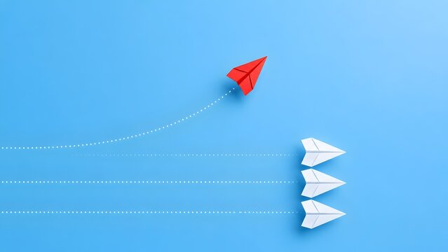 Red paper airplane deviates from white planes on blue background