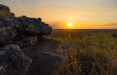 Obraz premium Stunning sunset due to smoke from bushfires at Ubirr and view over the Nadab floodplain, in Kakadu National Park, Australia 