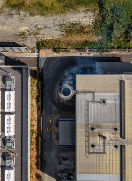 Aerial view of the CSR Bradford industrial facility featuring rooftop HVAC units, a circular vent, and paved access areas in Brendale, Queensland, Australia.