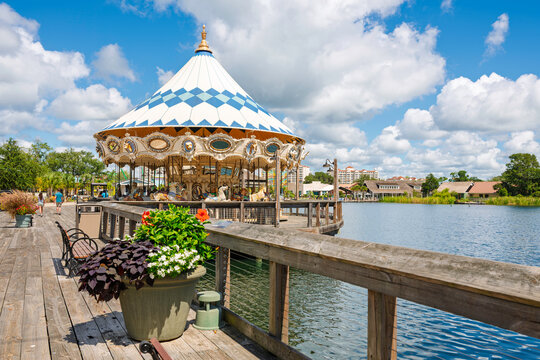 A colorful carousel with antique wooden horses along a waterfront pedestrian boardwalk on the Intracoastal Waterway of Myrtle Beach, South Carolina, Southern USA.