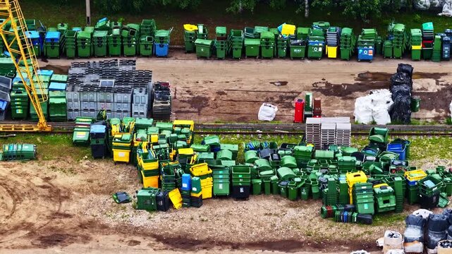 aerial view of sorted municipal waste bins and recycling containers at storage depot.