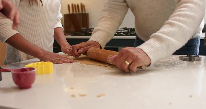 On starting festive baking girl smoothing dough while man rolling pin to create holiday cookies