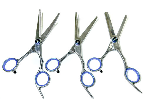 Professional hair cutting scissors set vector illustration, three stainless steel hairdressing shears with blue finger ring inserts and adjustable tension screws on a white background, salon graphic d