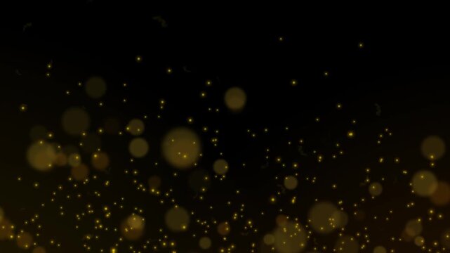 Bokeh effect with golden light particles floating across a dark background.